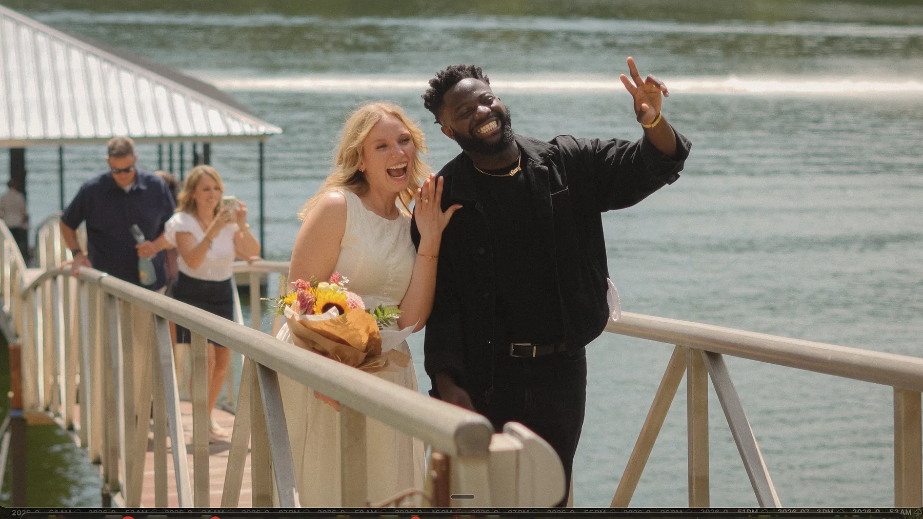 Pointing and celebrating on the dock walkway