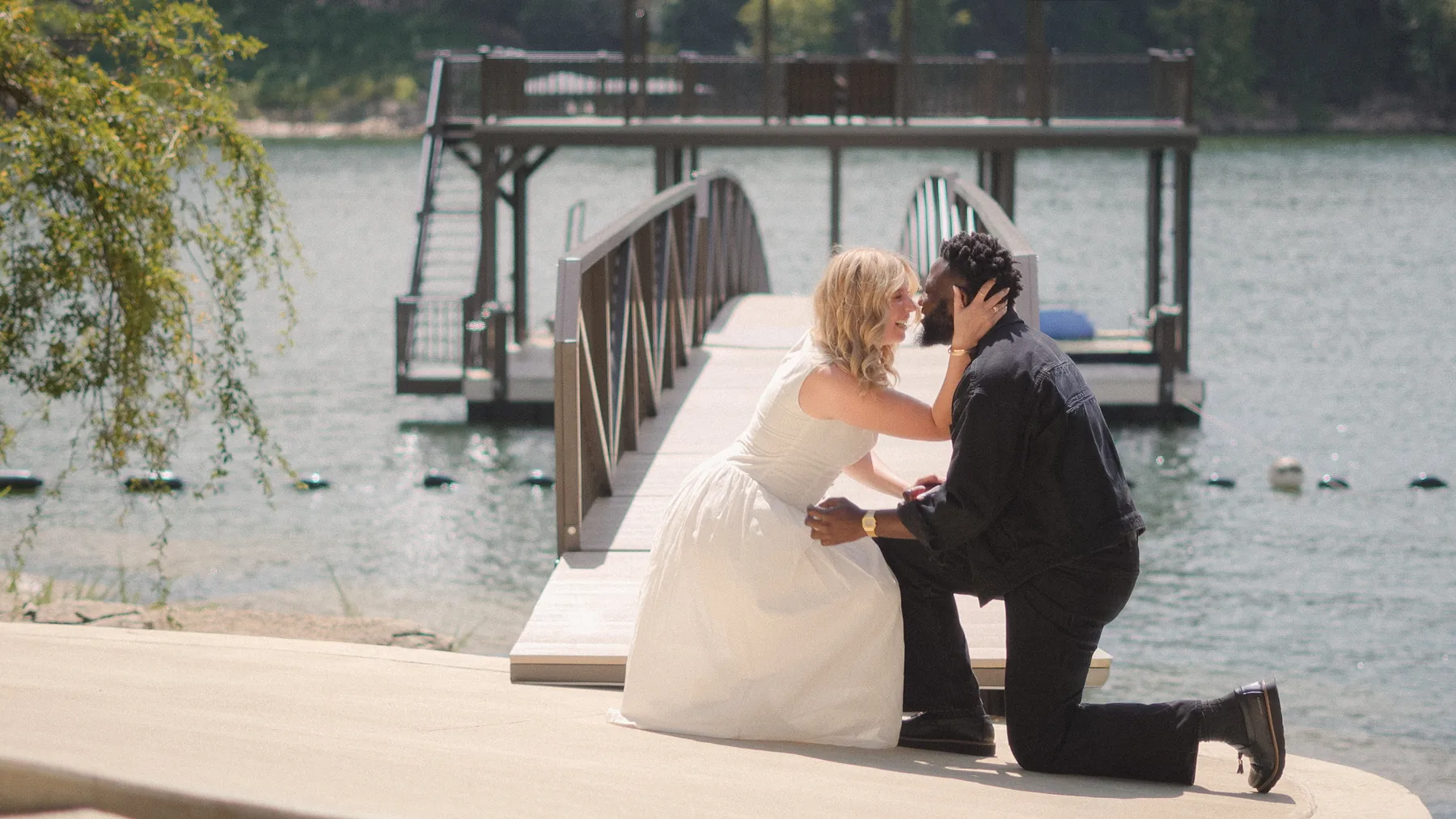 An embrace on the dock right after the yes